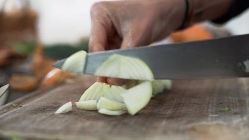 Close Up Video of a Person Slicing Onions