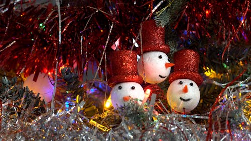 Close up on Flashing Lights among Christmas Snowmen