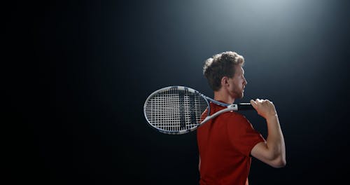 Man Holding Tennis Racket