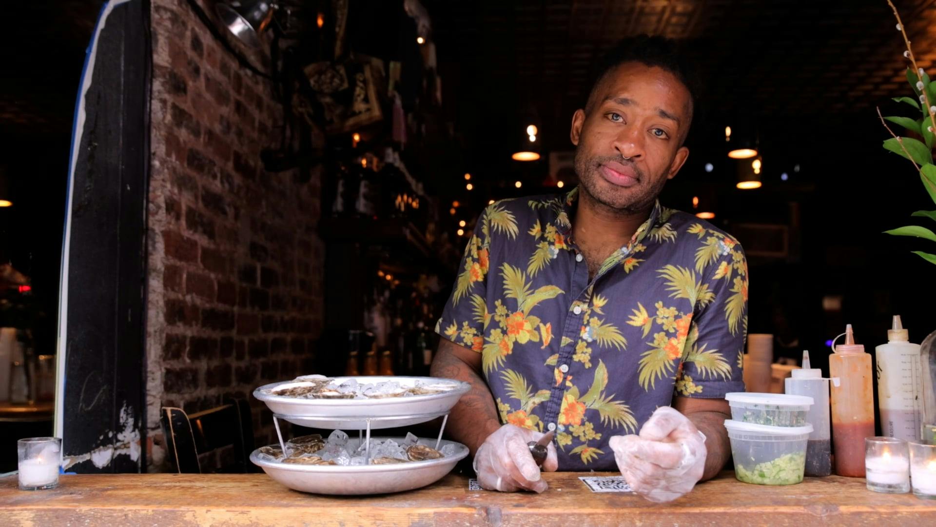 Man in Gloves Standing next to Dishes with Seafood Free Stock Video