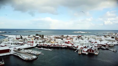 Aerial Footage of a Coastal Town Covered in Snow 