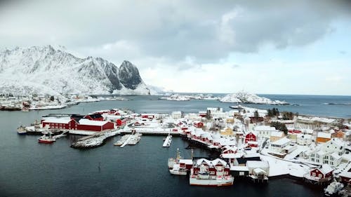 Drone Footage of a Coastal Village Covered in Snow 