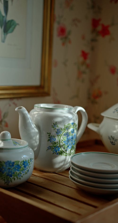 Close up of a Person Placing a Lid on a Teapot