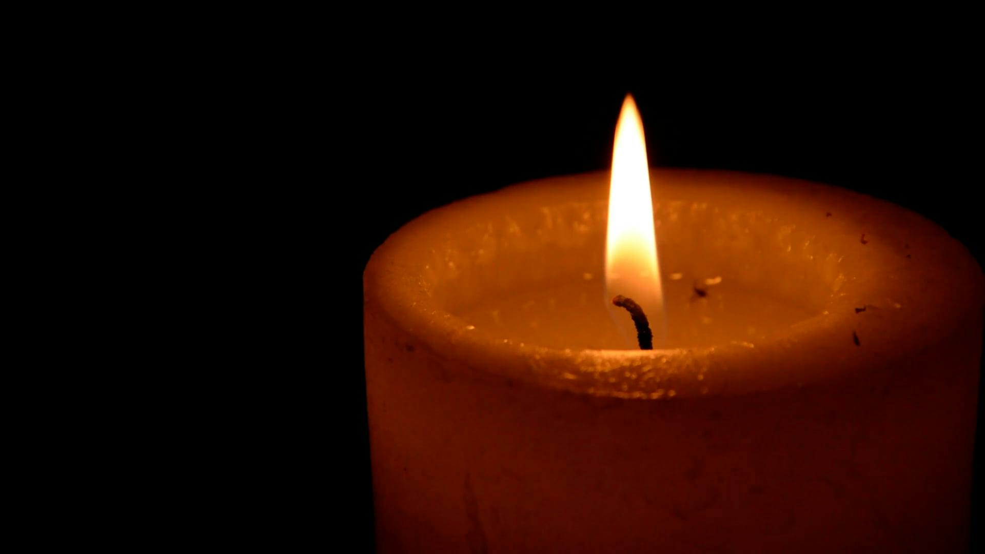 Closeup View Of A Lighted Candle · Free Stock Video