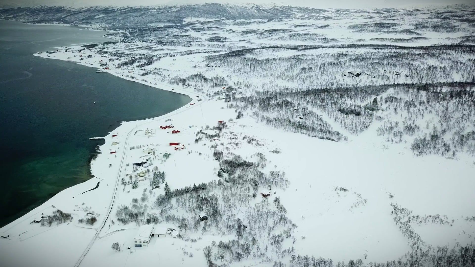 Aerial View of a Coastal Landscape Covered in Snow Free Stock Video ...