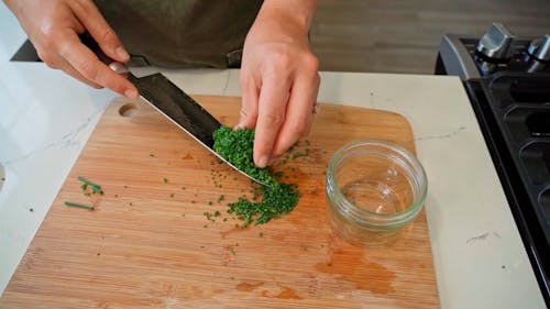 Person Chopping Onion Leaves