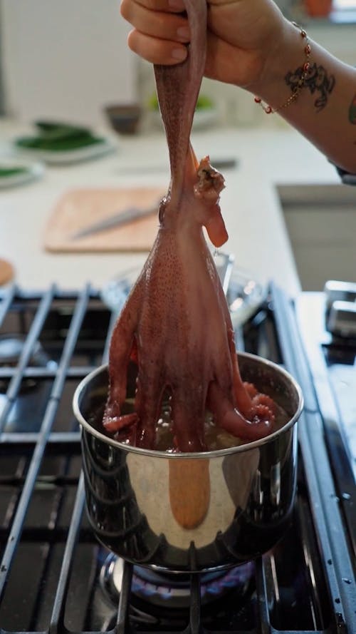 A Person Cooking an Octopus