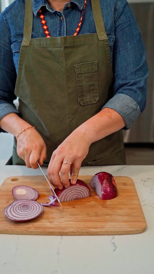 A Person Chopping Red Onions