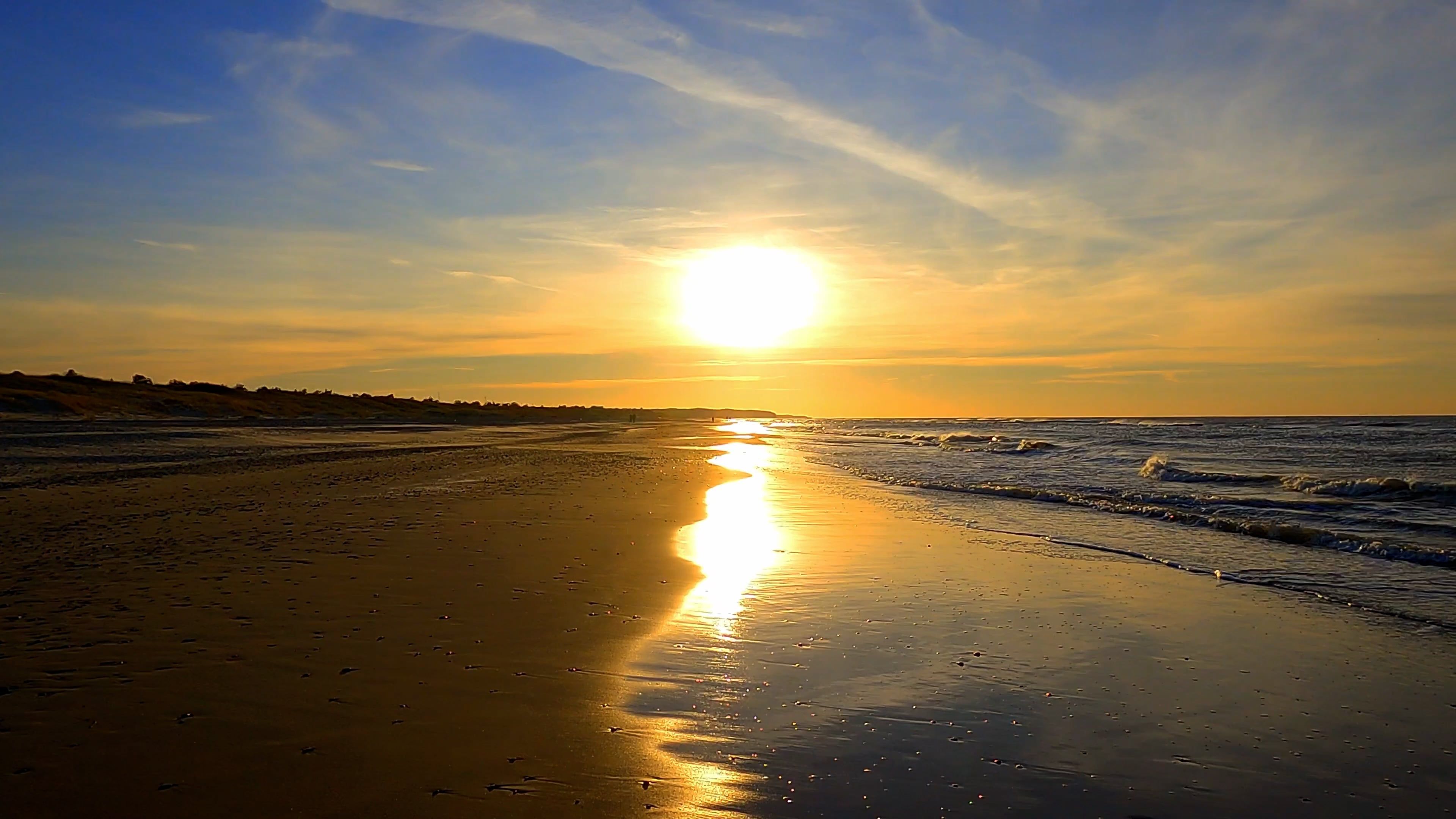 a shoreline with a picturesque sunset 10440923