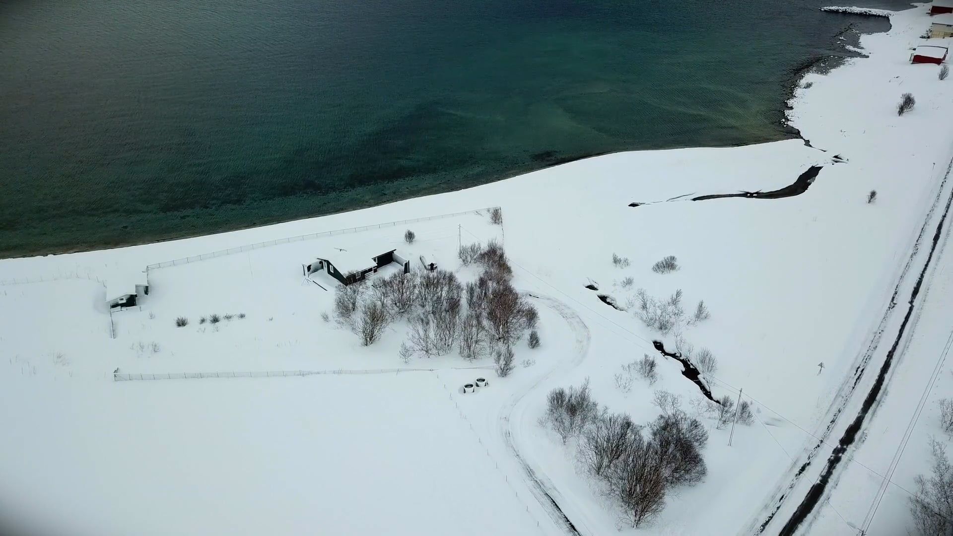 Drone Footage of a House by the Sea Covered in Snow Free Stock Video ...