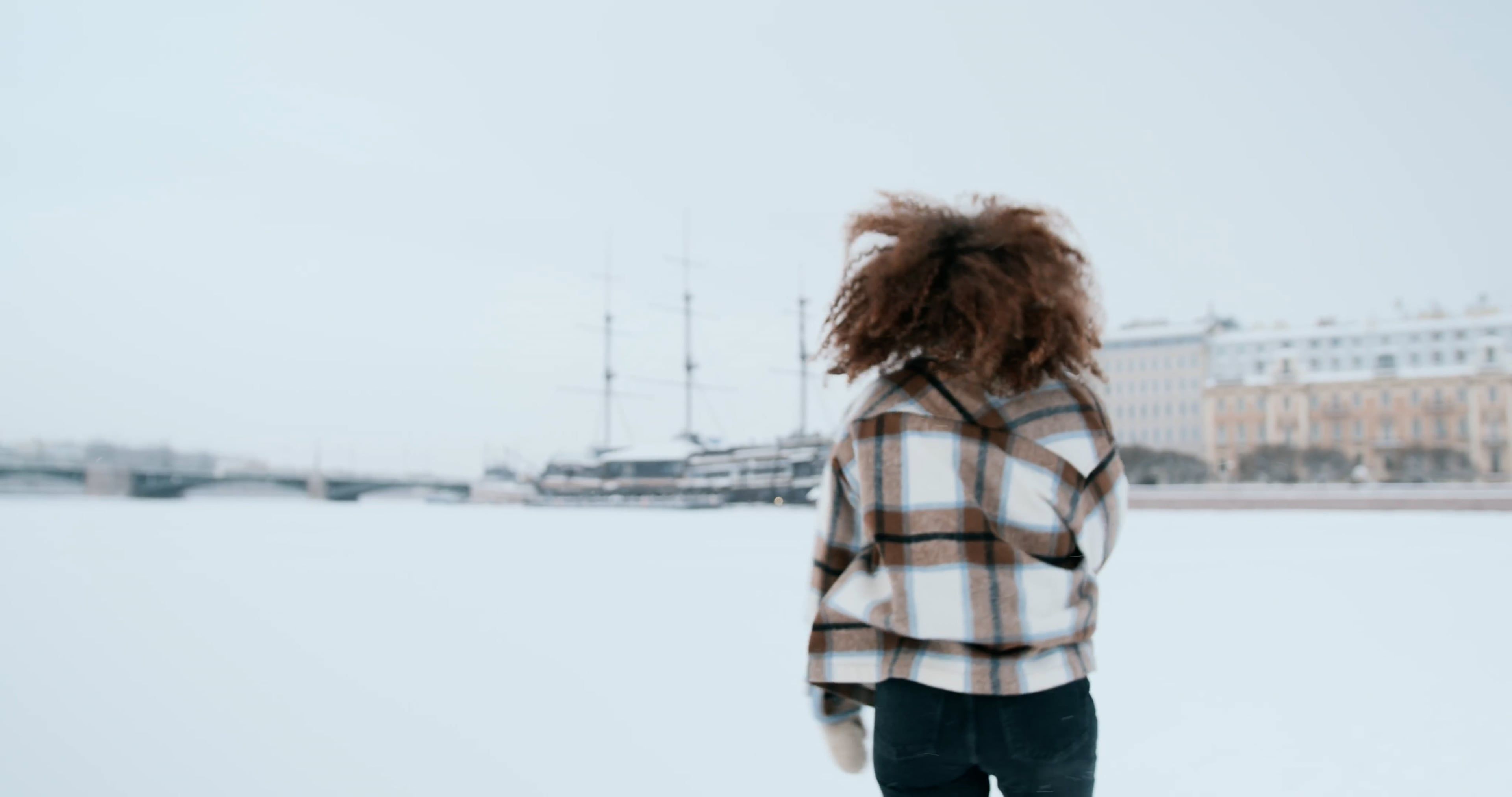 a woman running on a snow covered landscape 10453254
