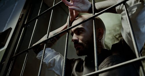 A Low Angle Shot of an Inmate Inside His Cell