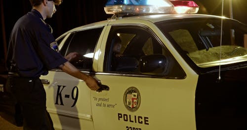 Police Officers Getting into Police Car