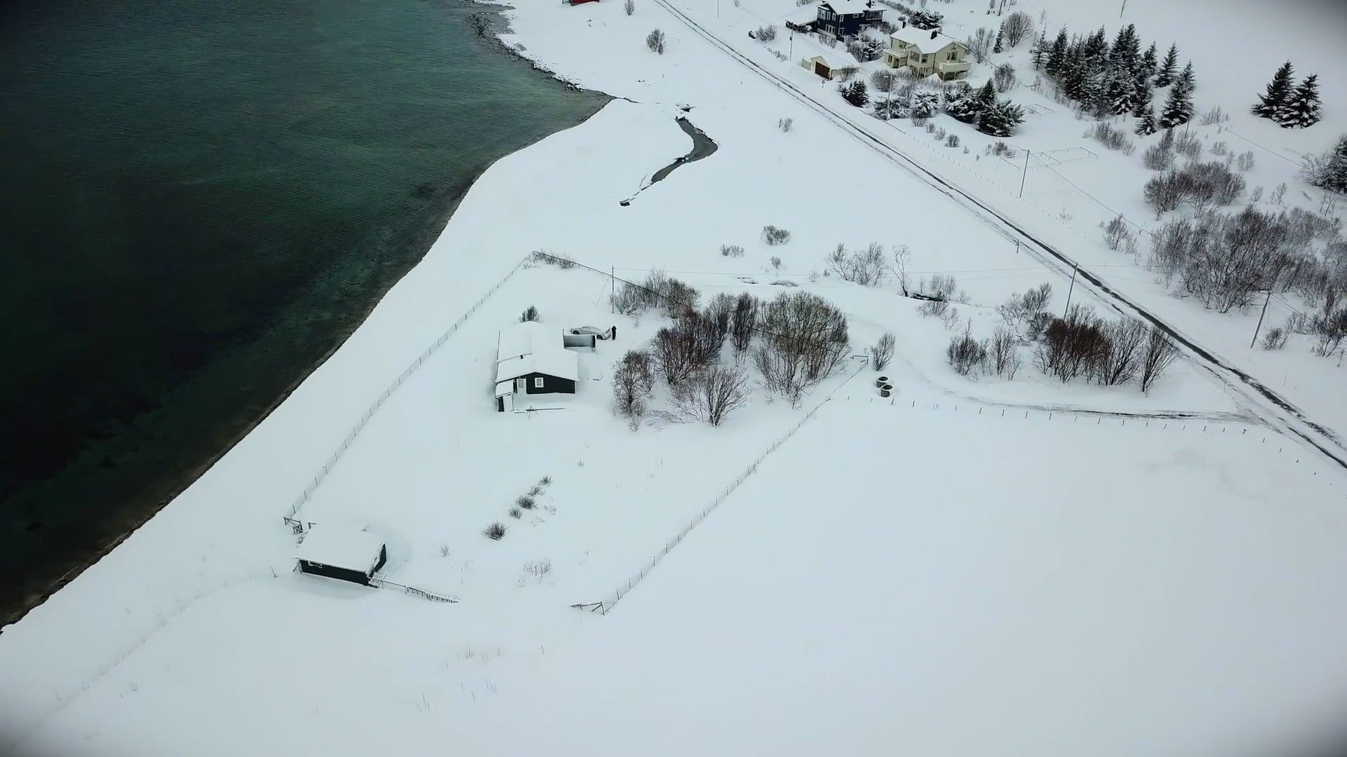 Drone Footage of a Snow Covered House by the Sea Free Stock Video ...