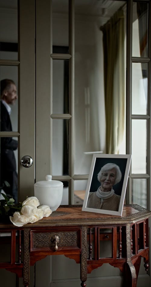 A Grieving Man Looking out the Window 