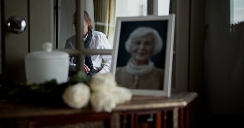 An Elderly Man Mourning his Wife  