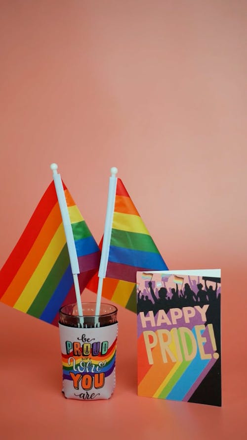 Colorful Composition with Rainbow Flags and a Happy Pride Card