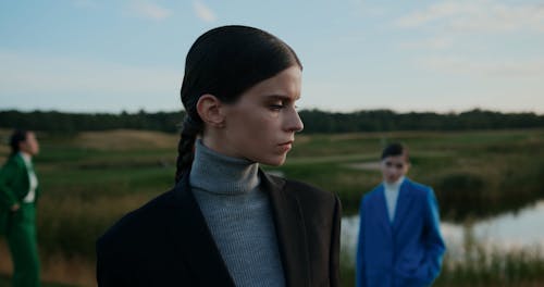 Women in Suits on Grass