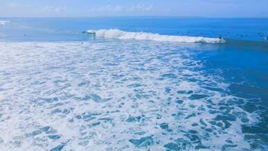 surfer on wave on sea