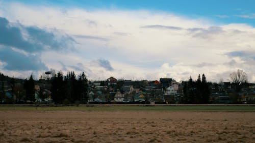 Cloudy Sky over Houses in Autumn