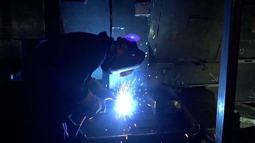 Man Working at Welding in Factory