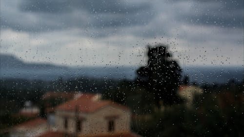 Time Lapse of Raindrops Falling on a Window Glass