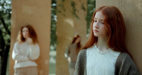 Young Women Posing on Pillars