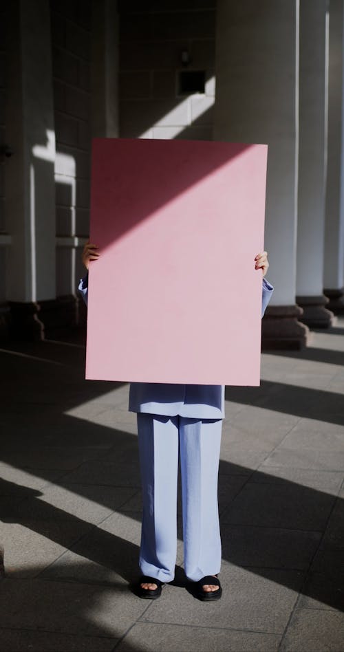 Woman Posing in Pink Suit