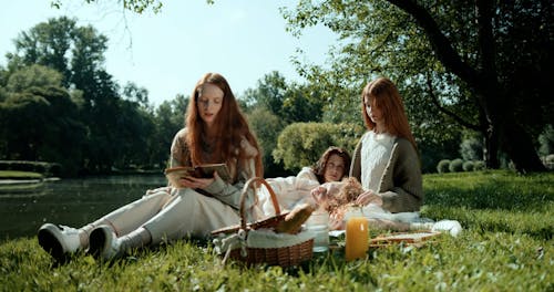 Young Women Having a Picnic at a Park