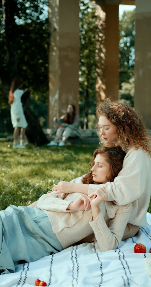 Young Women Having a Picnic at a Park