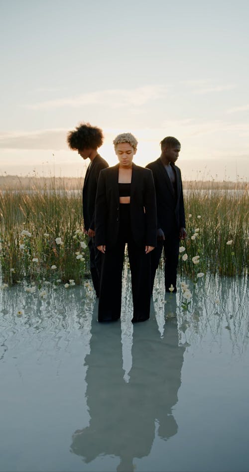 Woman with Men in Suits in Water