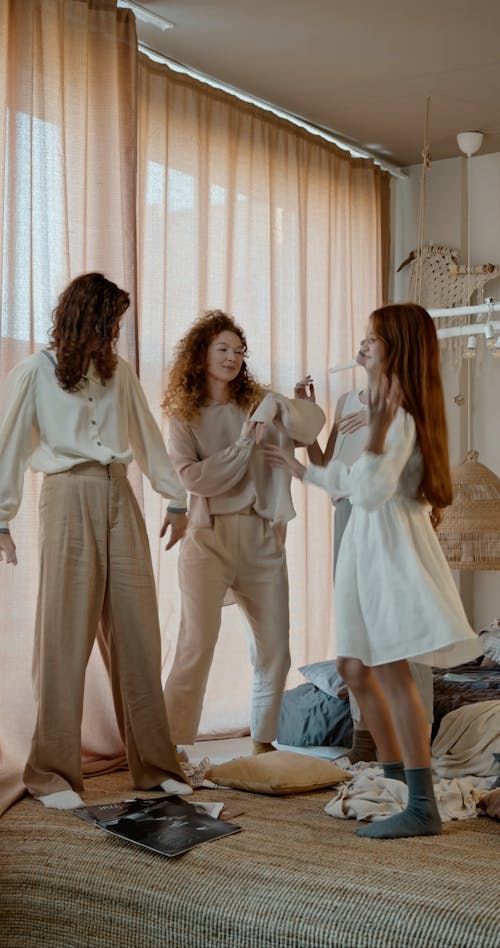 Young Women Dancing Together in a Room