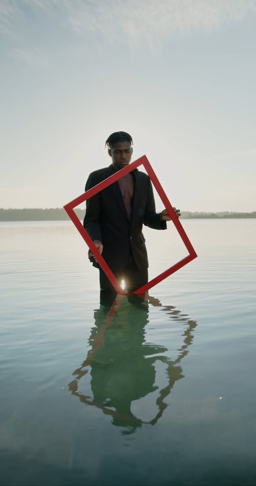 Man with Frame in Water