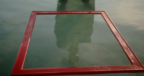 Man by Frame on Water