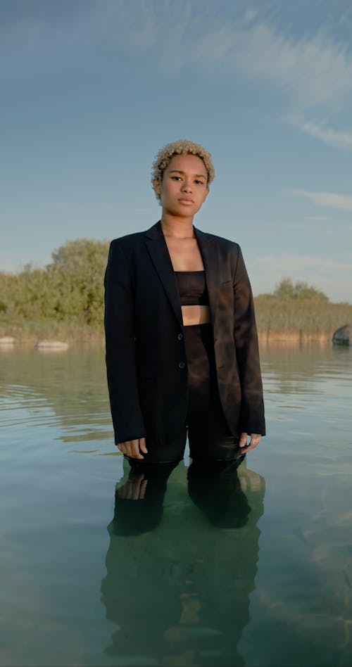 Woman in Suit and with Dyed Hair in Water