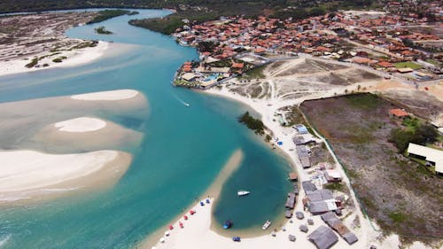 Aerial Footage of a Beach and a Small Town 