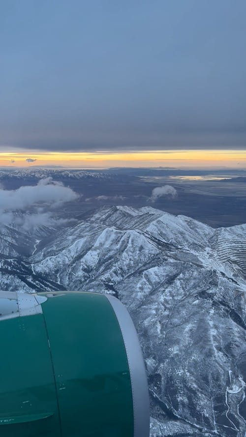 Snowy Mountain Landscape Seen from Airplane