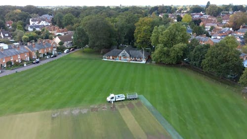 Aerial View of Grass Field in Town