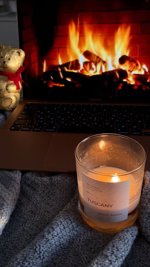 Fireplace Video on Laptop and Candle