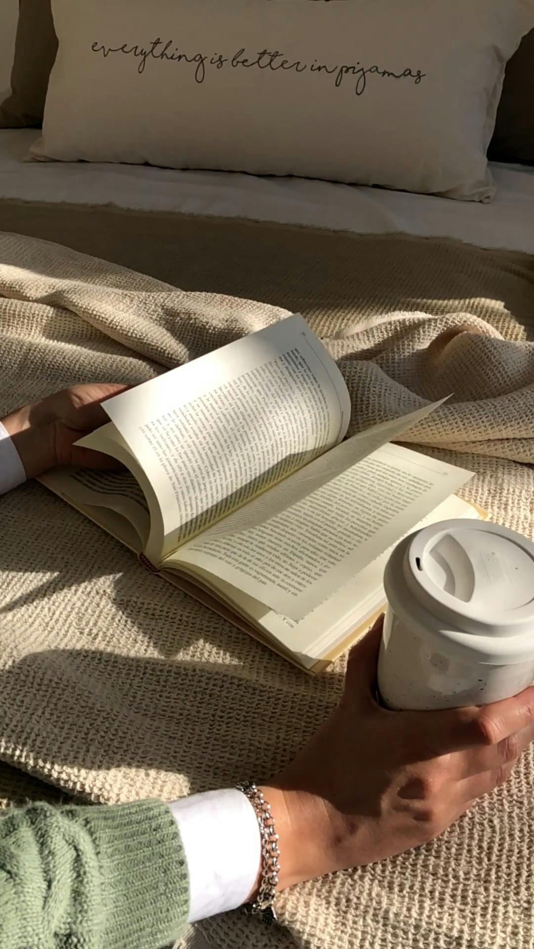 A Person Flipping Book Pages while Holding a Paper Cup Free Stock Video ...