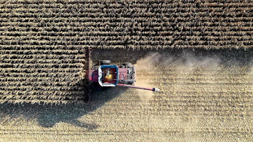 Drone Footage of a Tractor Harvesting Crops