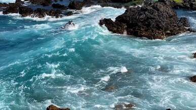 slow motion of waves on barren rocks on coast