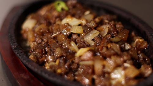 Close up on Adding Pepper to Asian Food on Pan