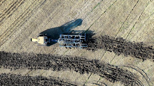 Top View of a Tractor Working on a Field 
