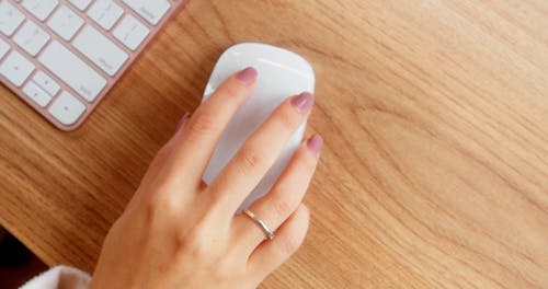 Overhead Shot of a Person's Hand Using a Mouse