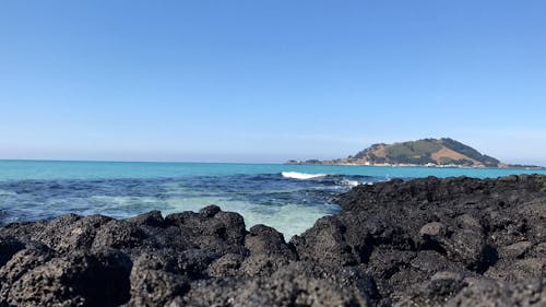 Clear Sky over Rocks on Sea Shore