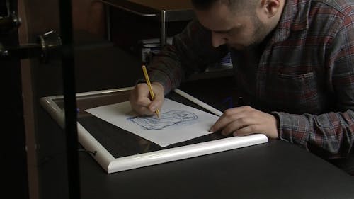 Man Making A Pencil Sketch