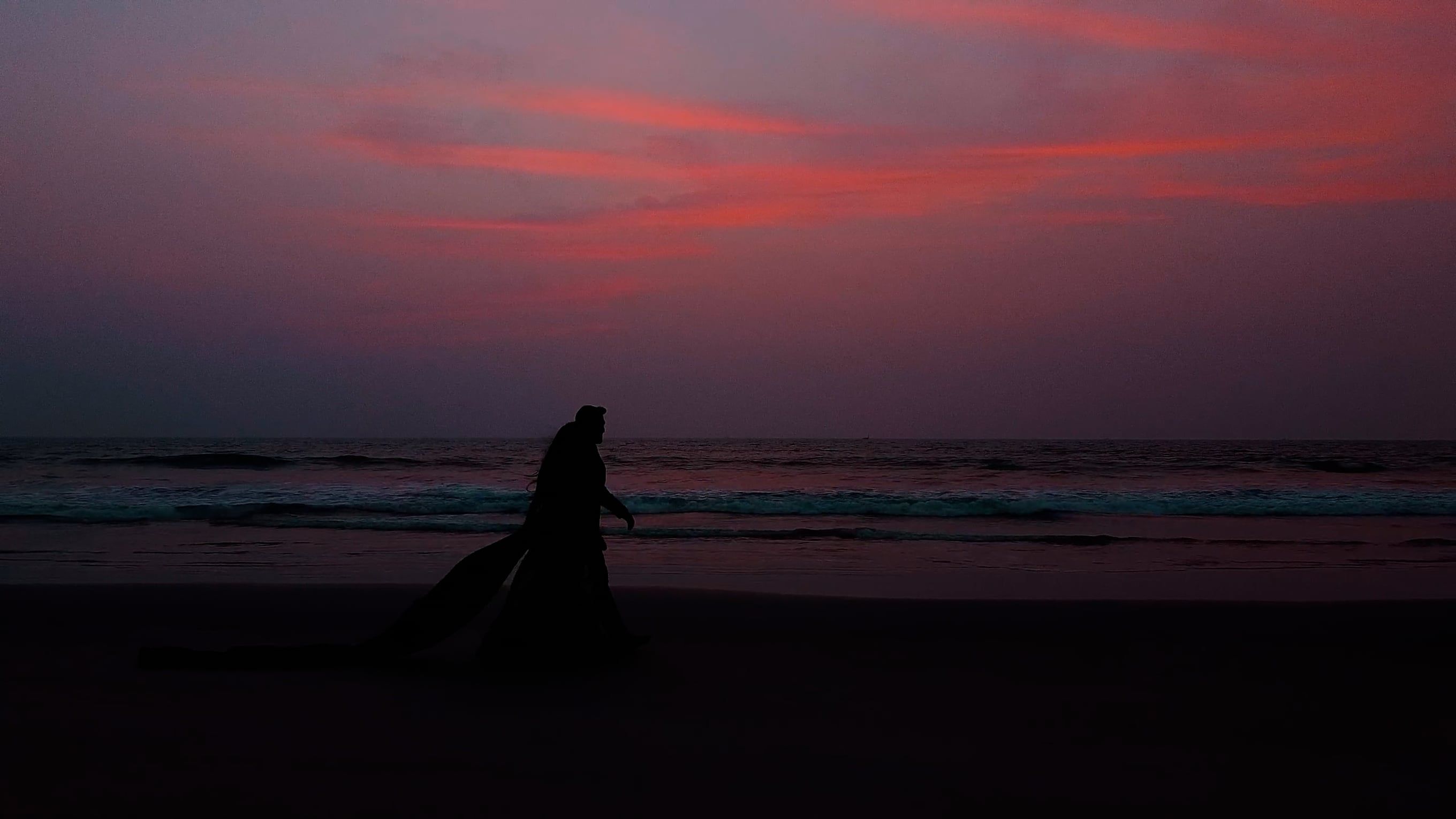 Silhouette of a Couple Walking on the Beach at Sunset Free Stock Video ...