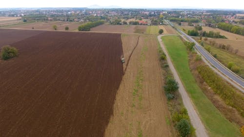 Aerial View of Tractor Ploughing Field