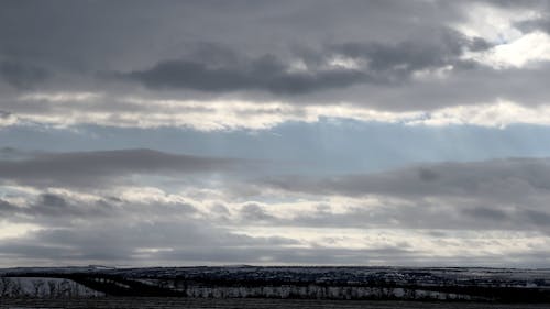 Time Lapse of Clouds Above Land